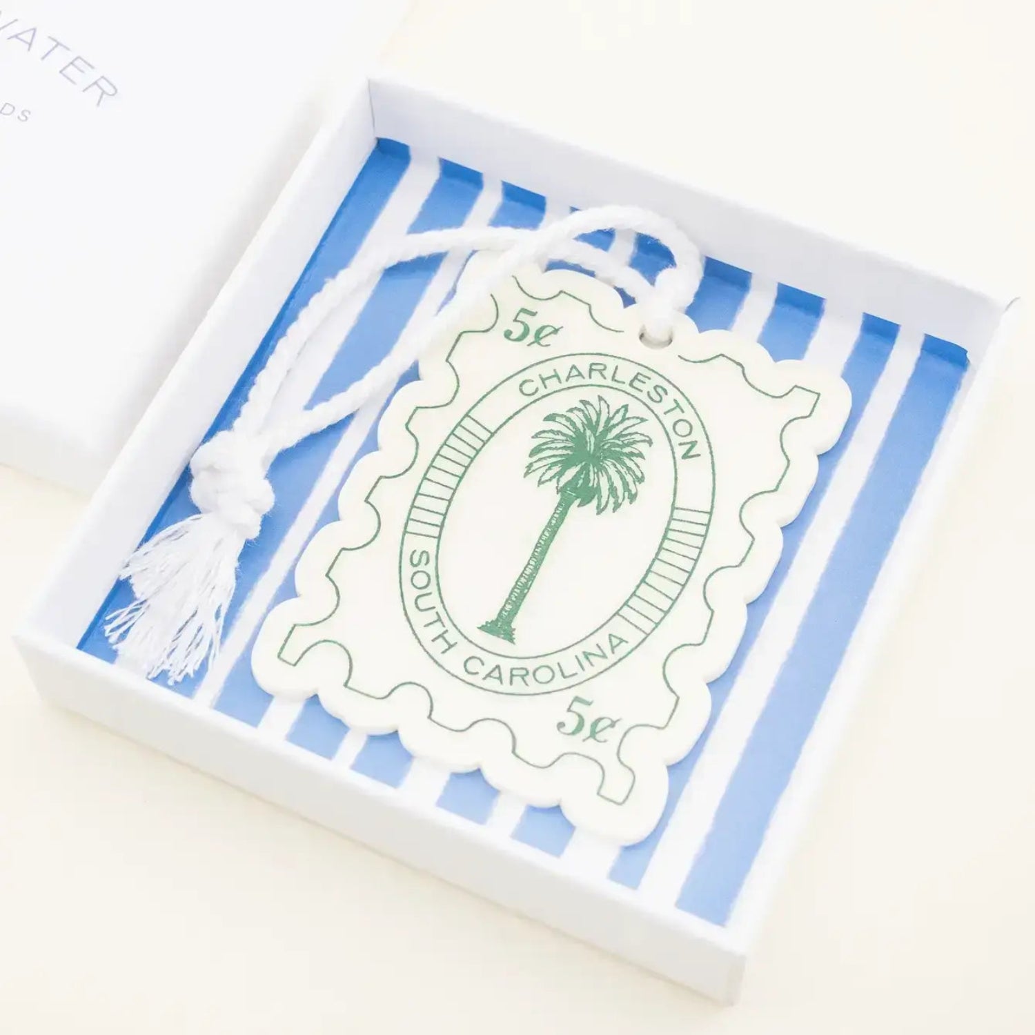 Box with blue and white striped design featuring a palm tree and 'Charleston South Carolina' text.