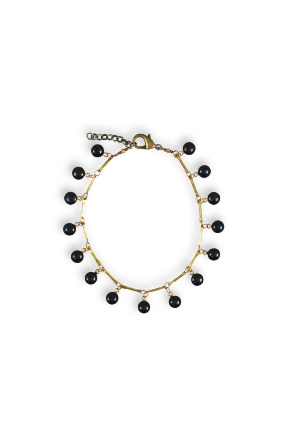 Anklet with black beads on a white background