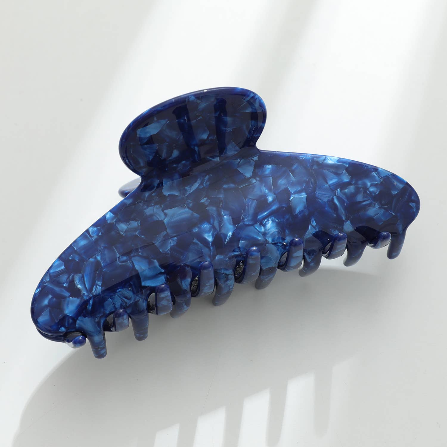 Blue hair clip on a white background
