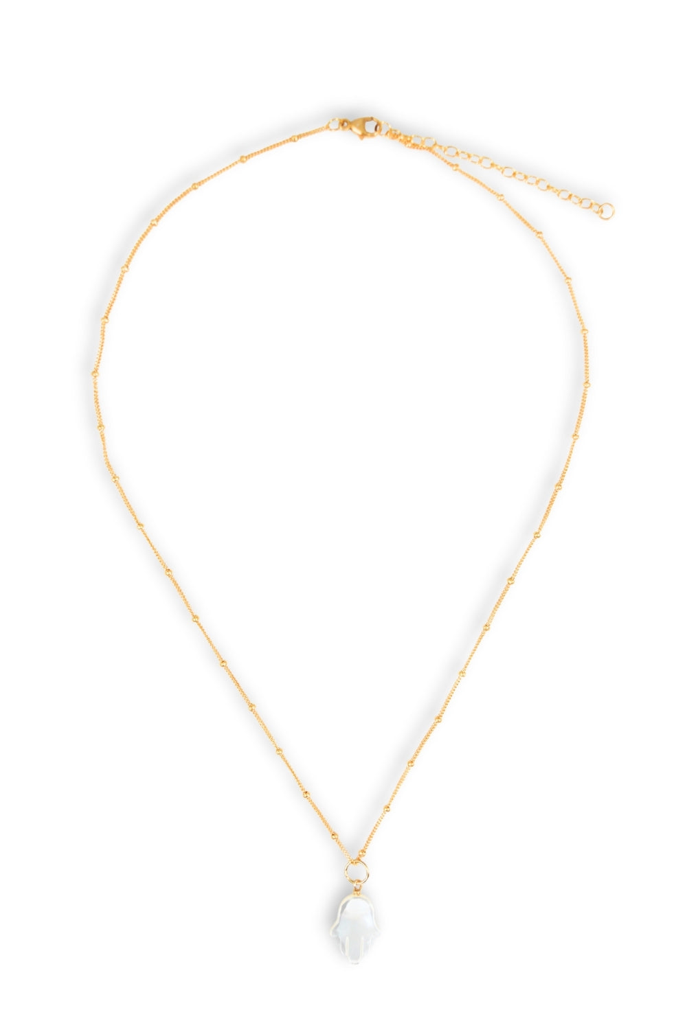 Gold necklace with a white hamsa hand on a white background