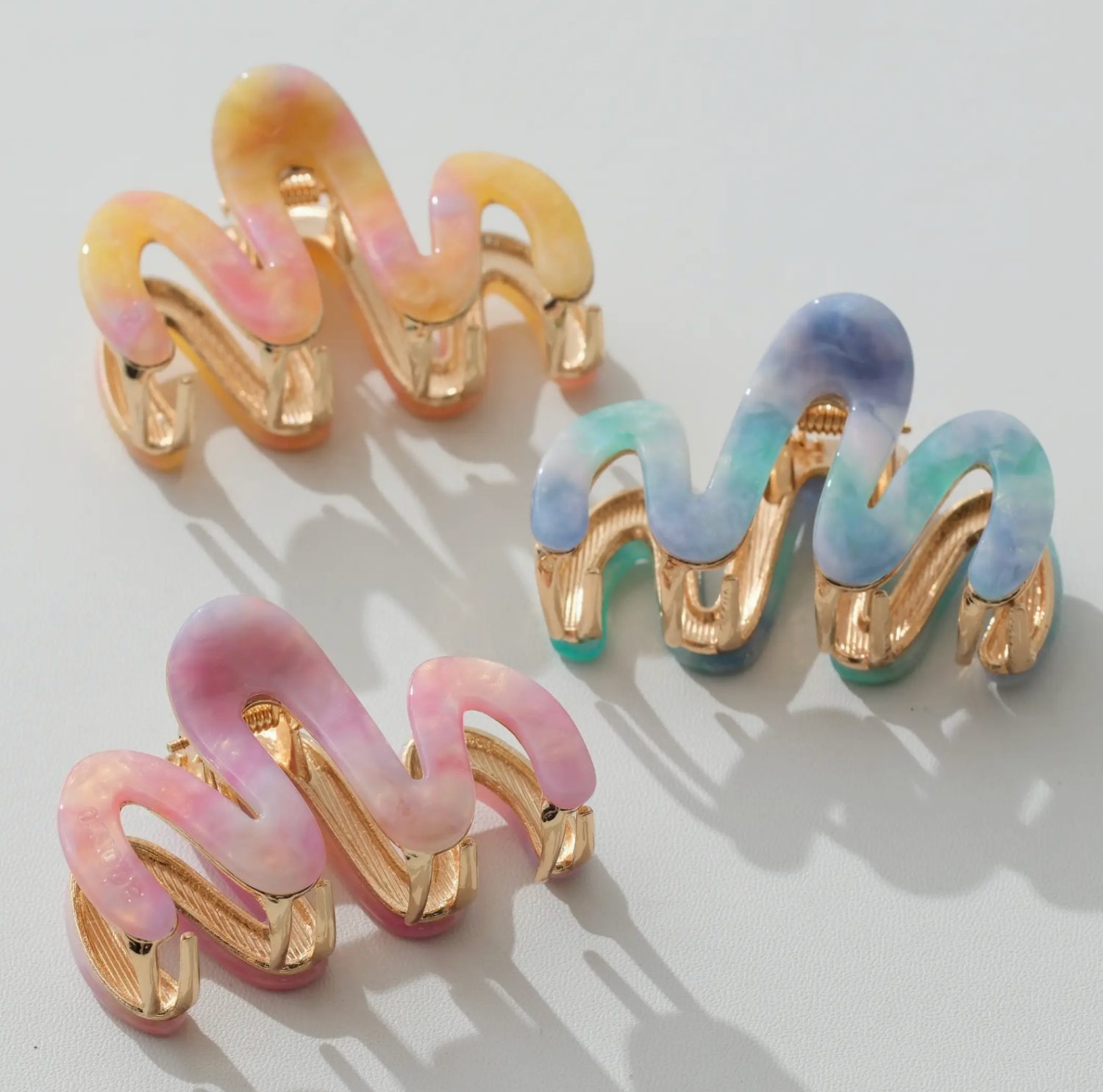 Set of colorful hair clips on a light background