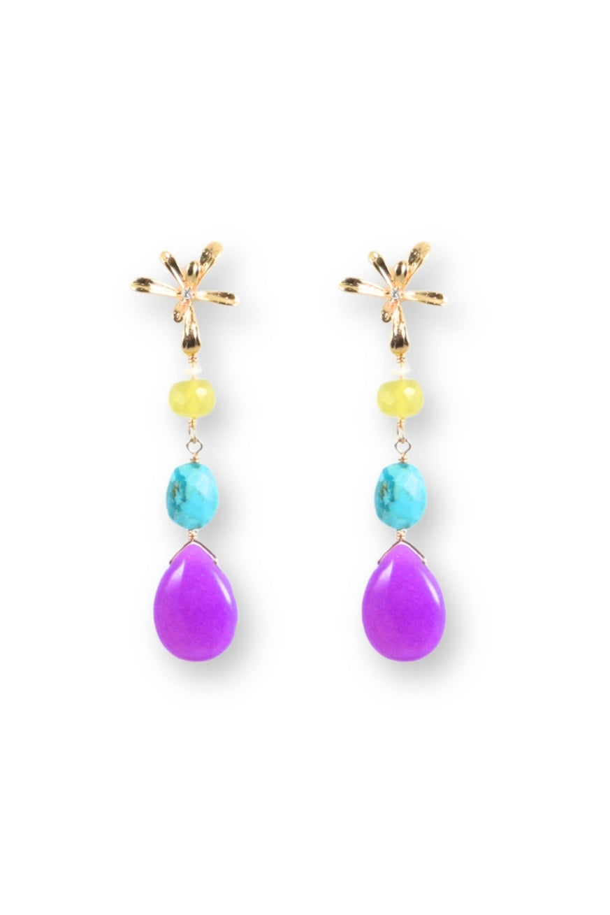 Pair of earrings with purple teardrop stones, yellow beads, and gold accents on a white background