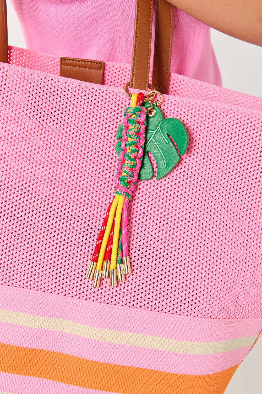 palm leaf bag charm on tote