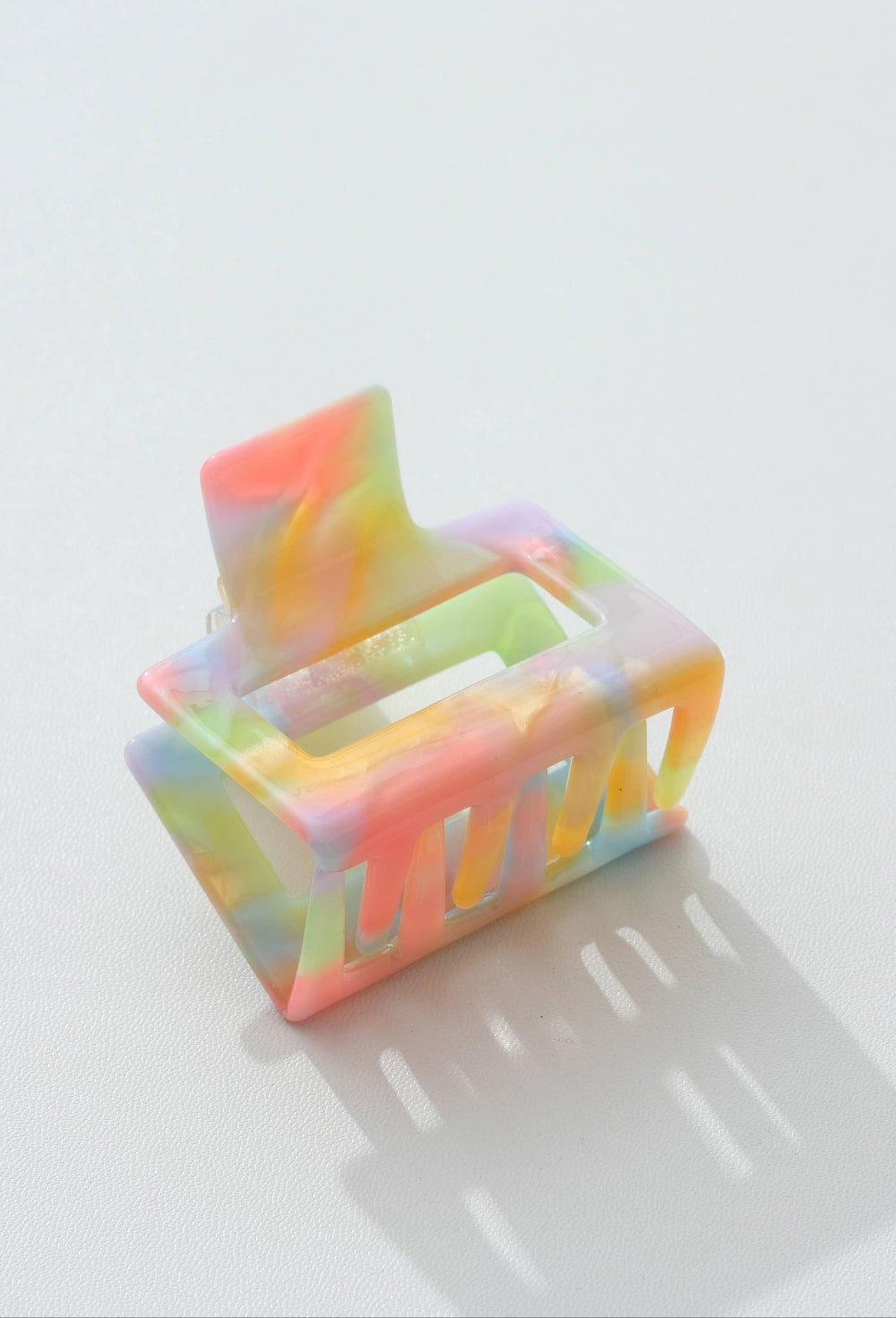 Colorful hair clip on a white surface