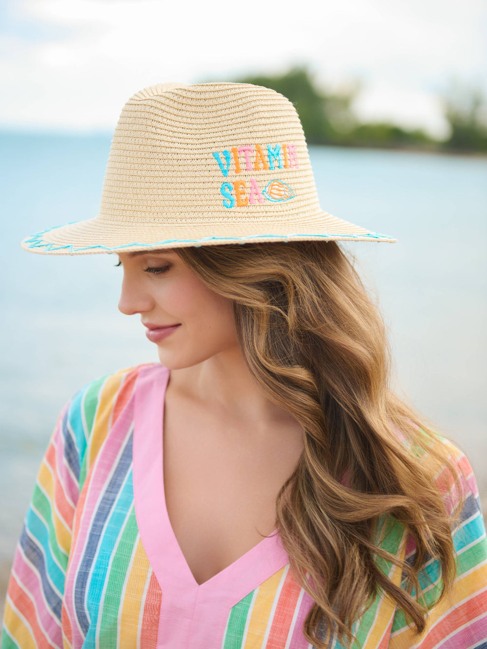 vitamin sea straw hat on model, side view