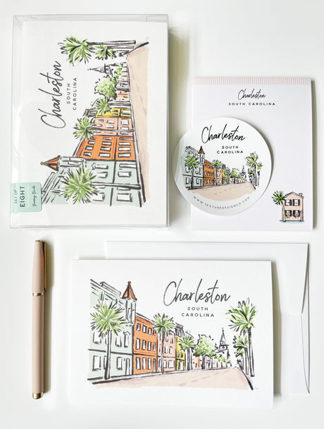 A set of Charleston, SC themed greeting cards with illustrations of the downtown area in pastel colors. Includes an envelope and a pen.
