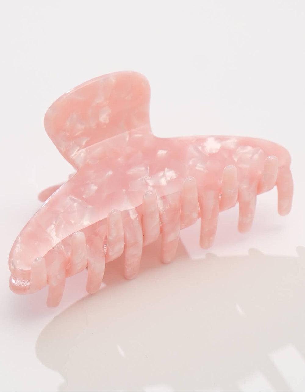 Pink hair clip on a white background