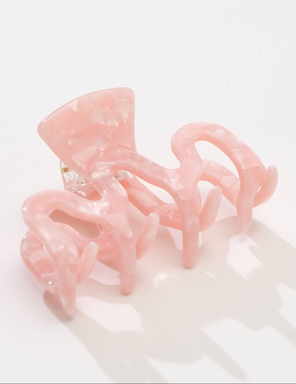 Pink hair clip on a white background