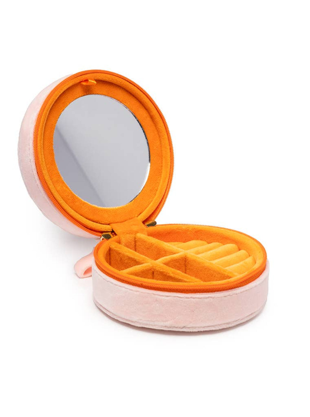 Open jewelry box with mirror lid on a white background