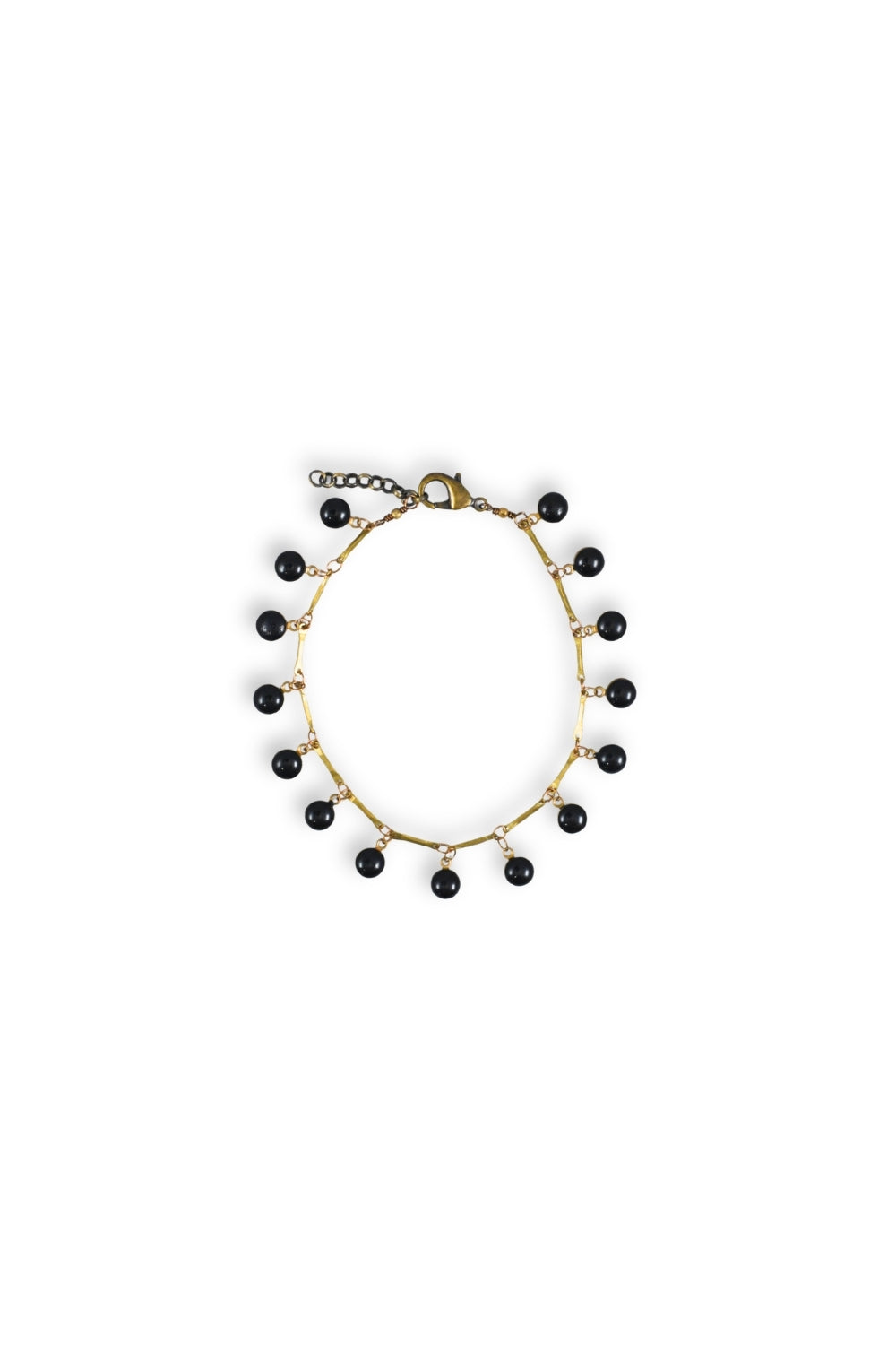 Anklet with black beads on a white background