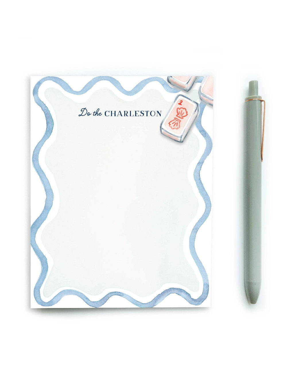 Notepad with decorative border and pen on a white background