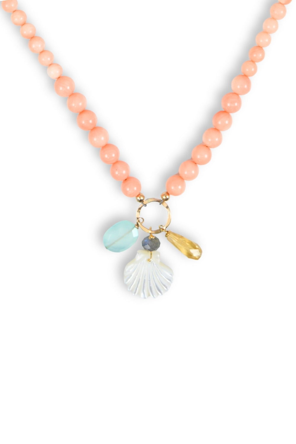 Necklace with coral beads and shell charm on a white background