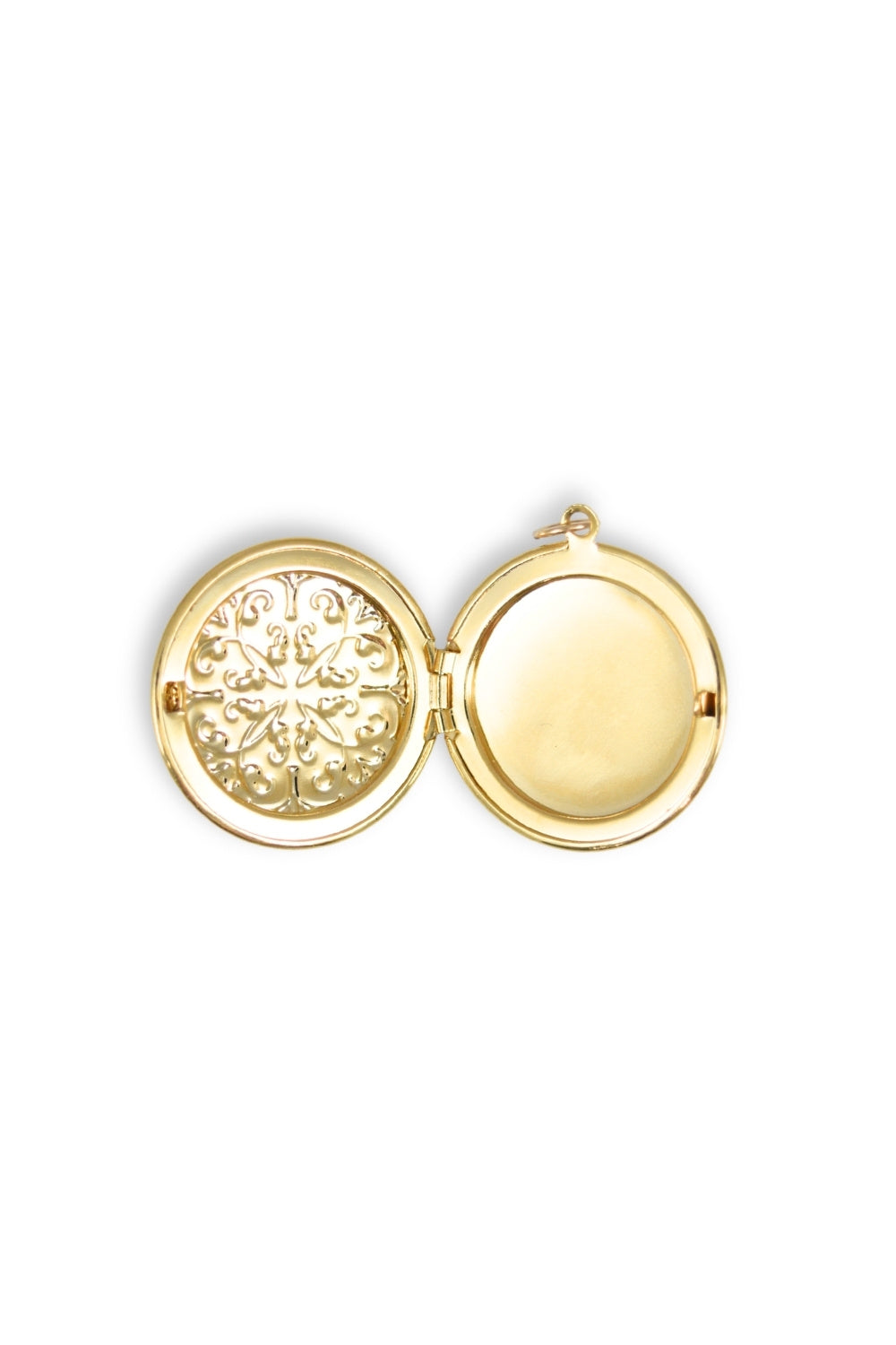 Gold locket with intricate design on a white background