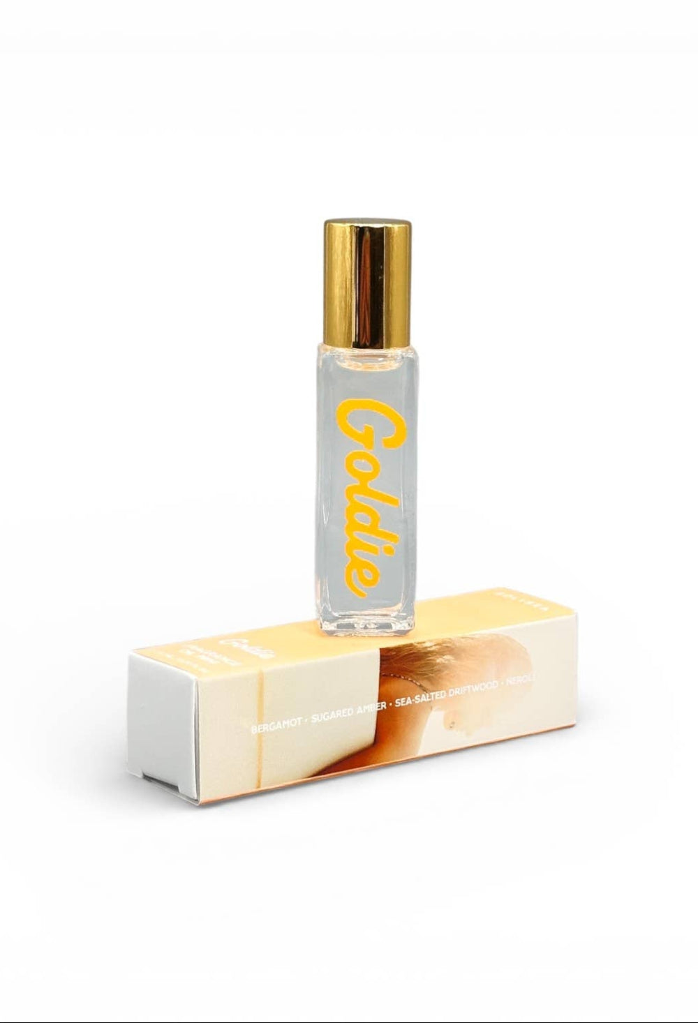 Roll-on perfume bottle with gold cap and 'Goldie' branding on a white background