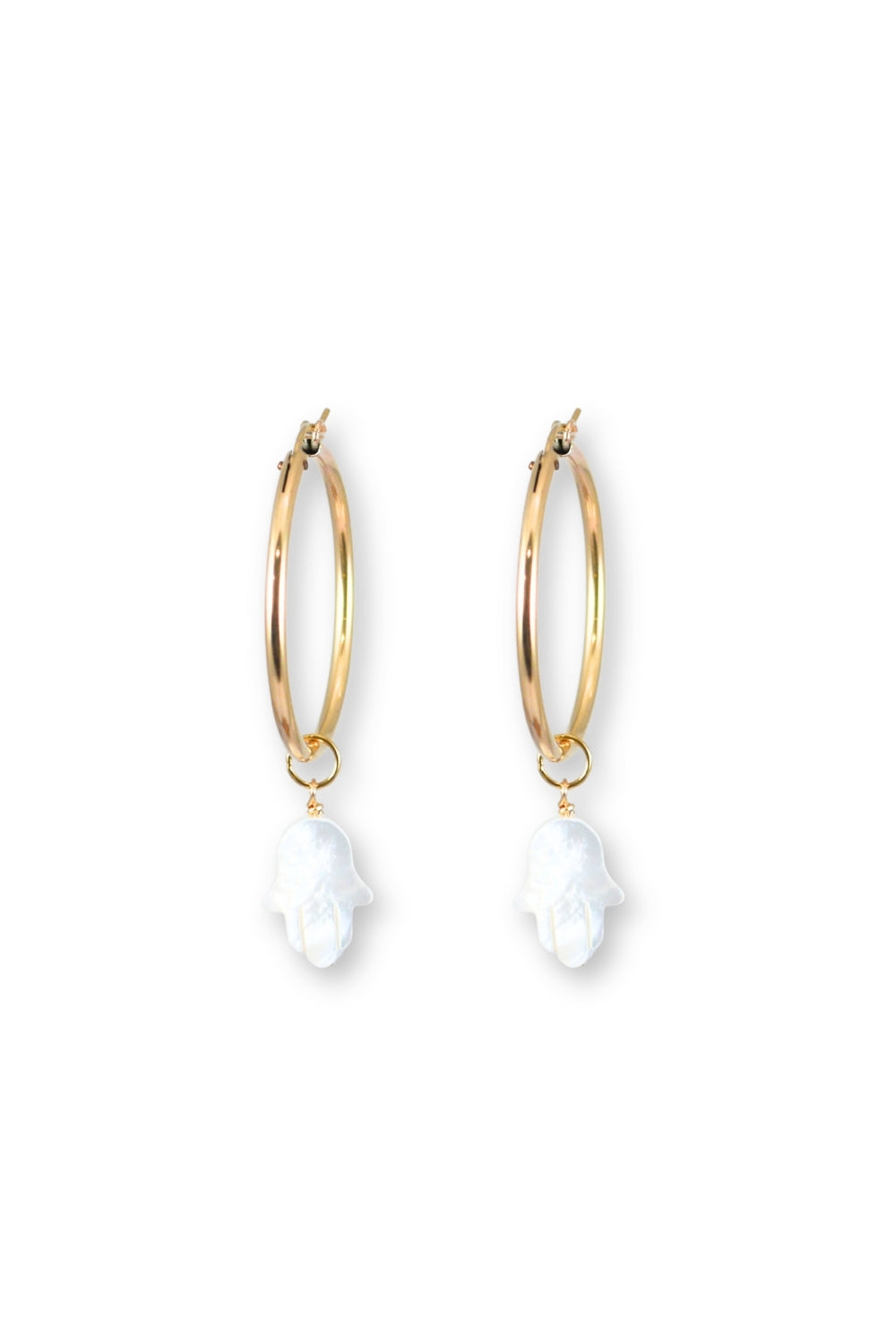 Gold hoop earrings with white hamsa hand charms on a white background