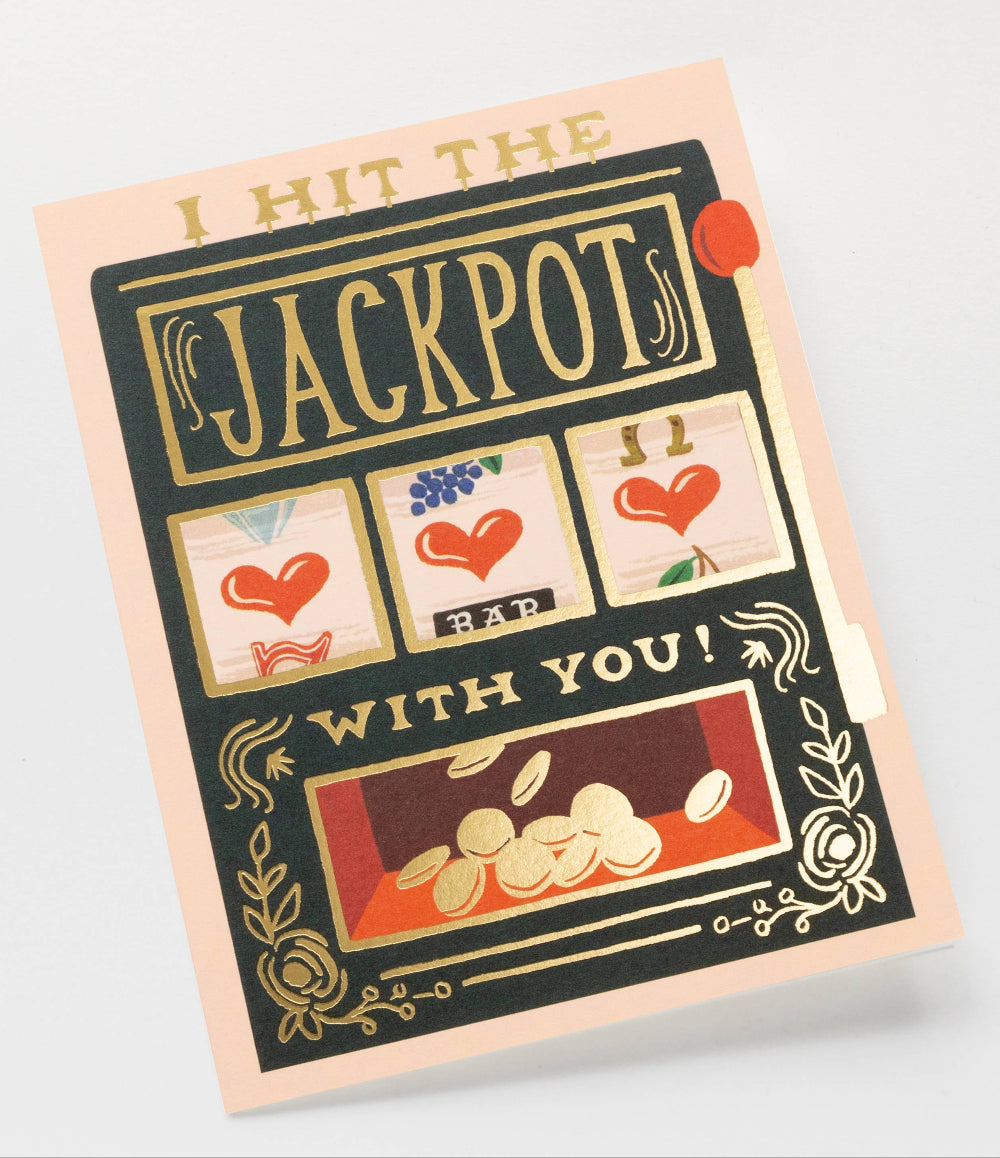 Greeting card with slot machine design and text 'I hit the jackpots with you!' on a light gray background
