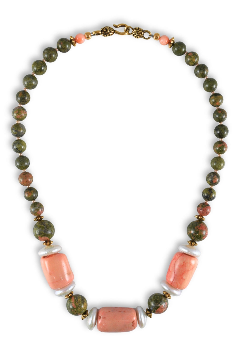 A beaded necklace featuring round green and pinkish-brown stone beads, two large rectangular coral-pink beads, and white spacer beads, with antique gold-toned metal accents and clasp.