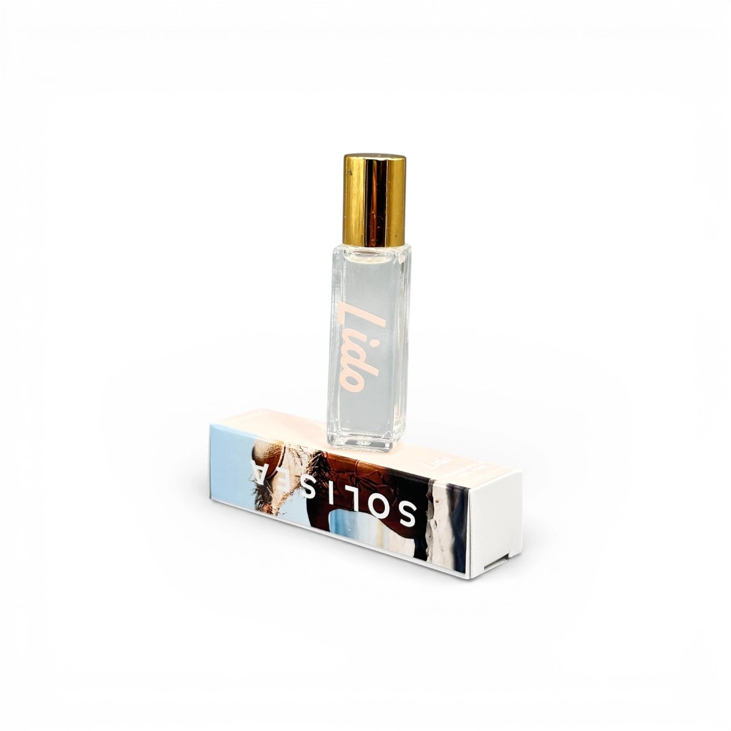 Small perfume bottle of Lido Solisea perfume with gold cap on a white background