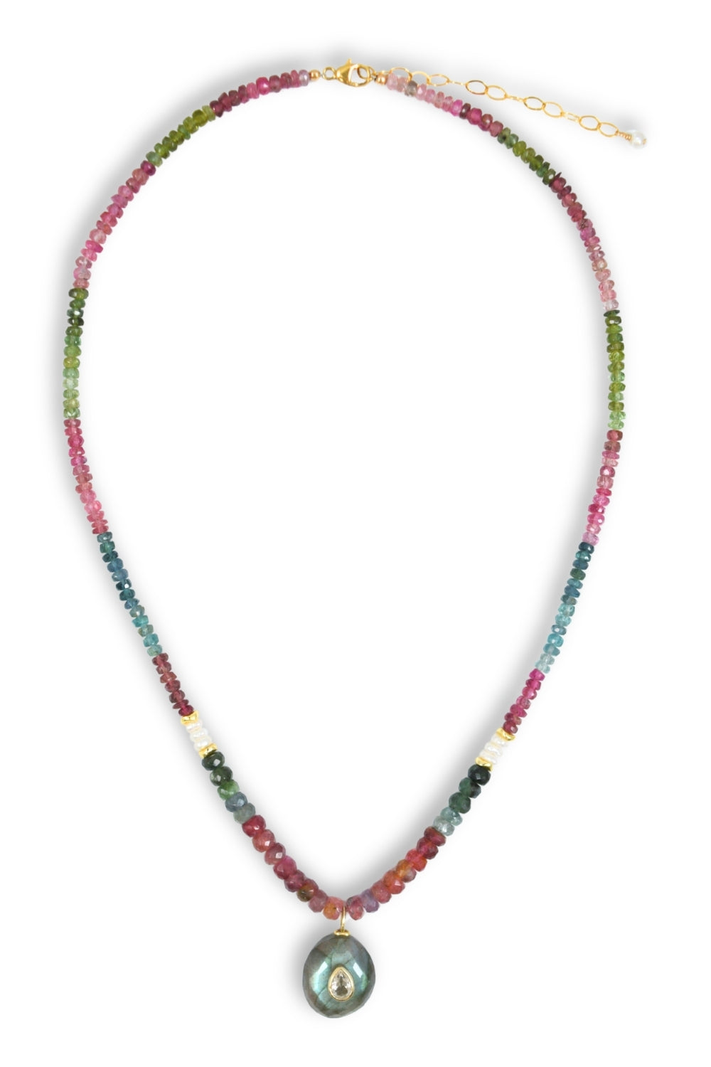 A beaded necklace featuring a gradient of colorful gemstone beads transitioning from green and pink at the top to teal and burgundy at the bottom, with a gold-tone clasp and extender chain, and a teardrop-shaped iridescent pendant depicting the Virgin Mary.
