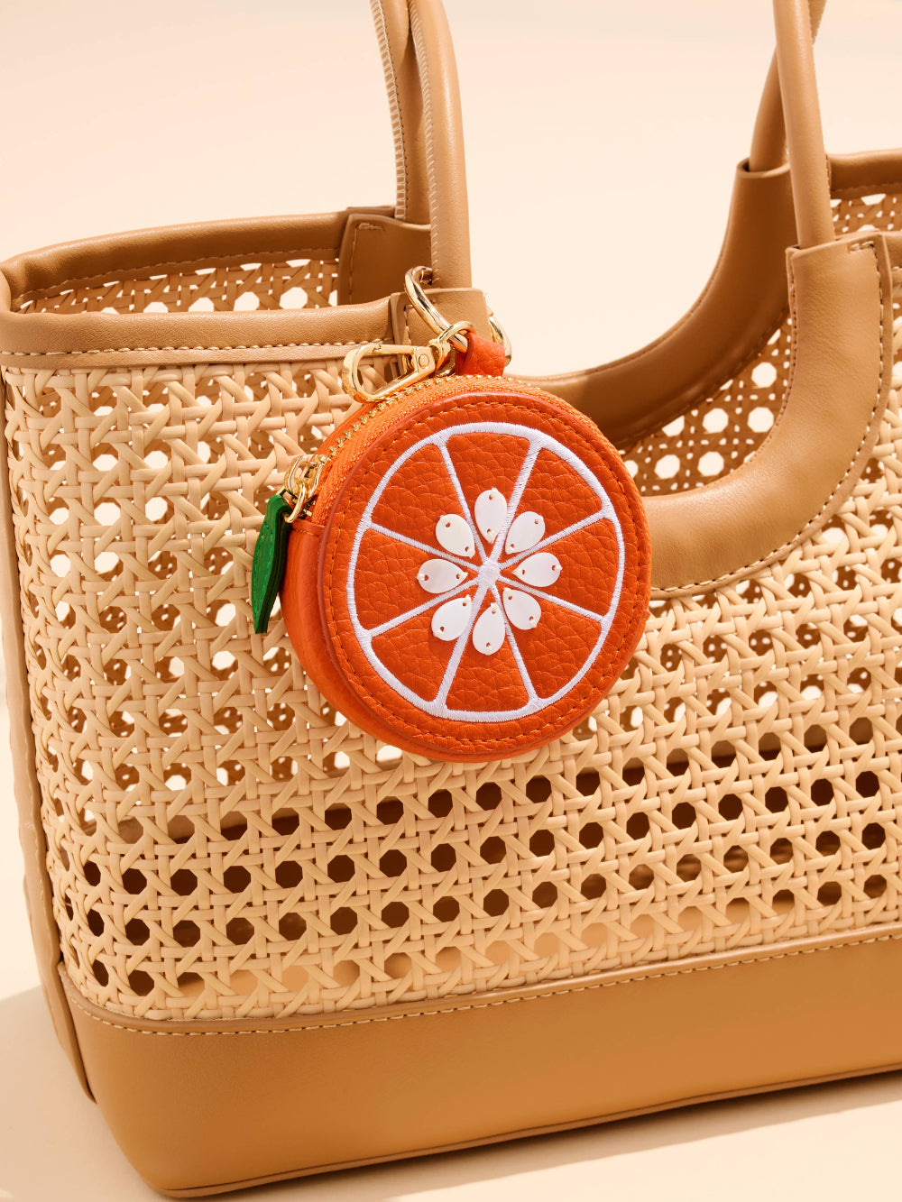 orange coin pouch on tote bag