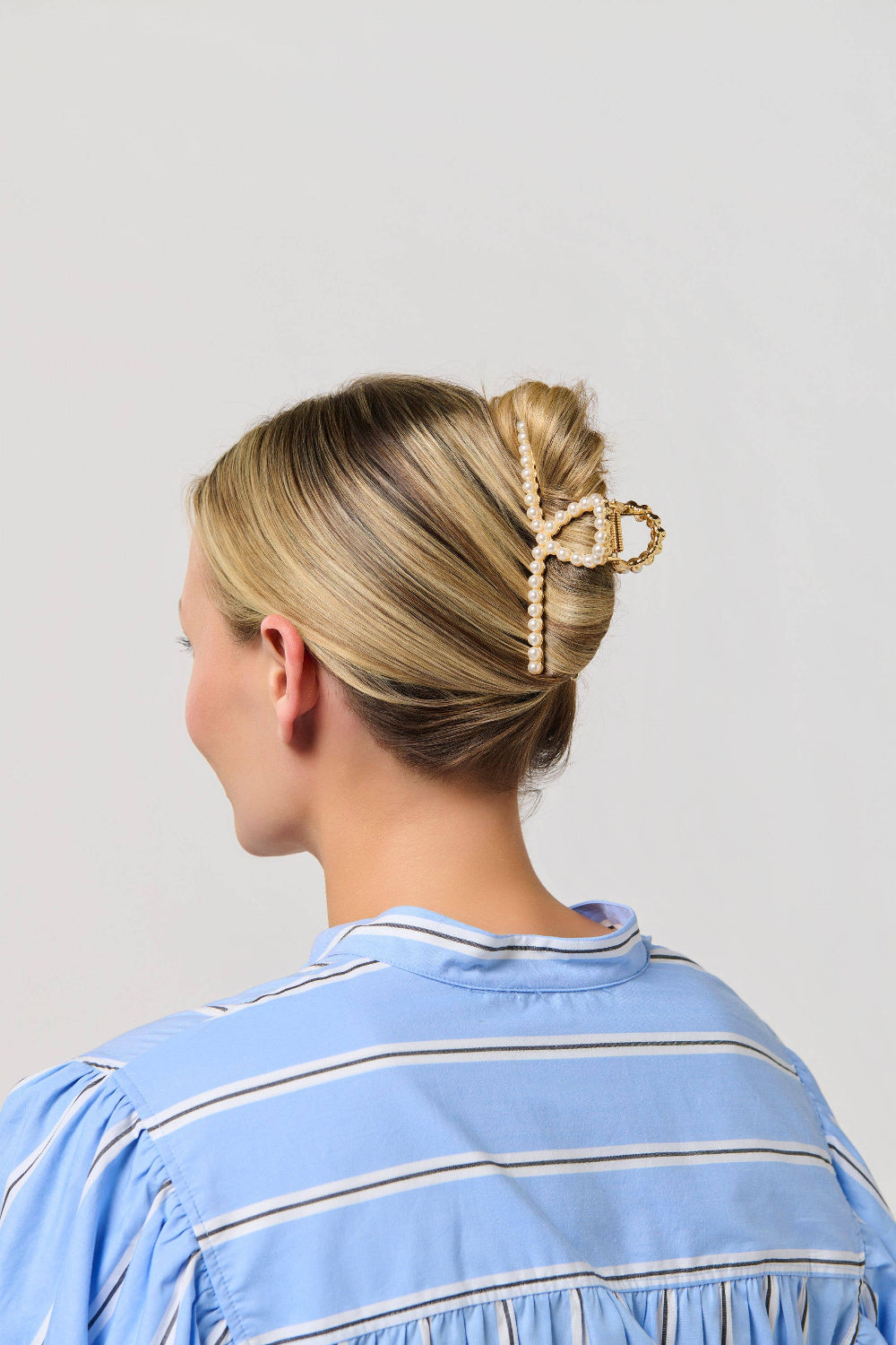 pearl claw clip on model with styled hair