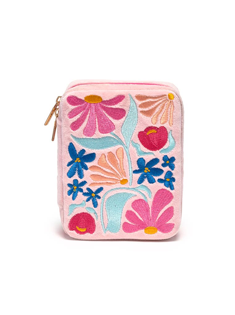 Floral-patterned jewelry case on a white background