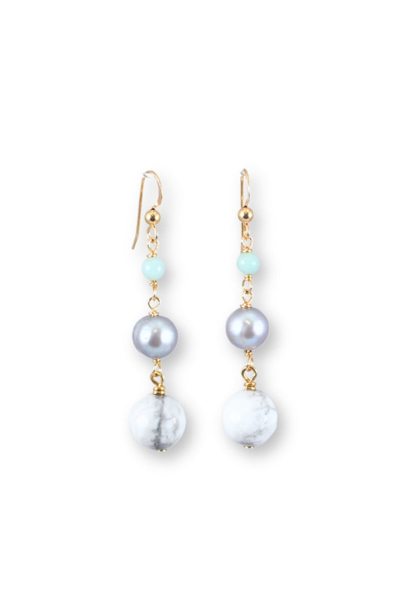 Pair of pearl earrings on a white background