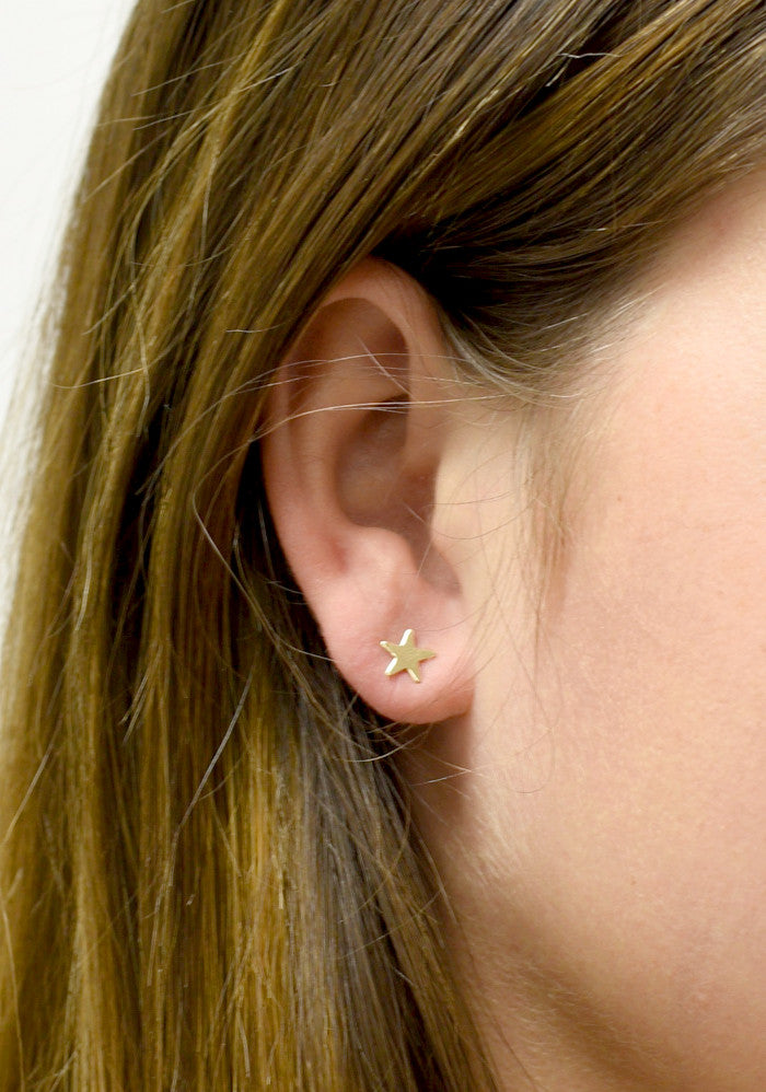 Tiny gold hot sale star earrings